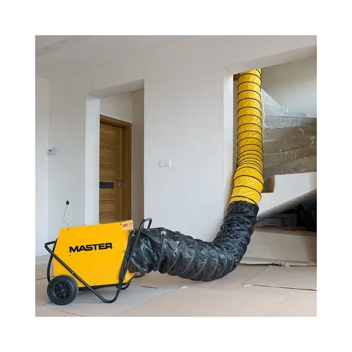 Master B30 ductable electric heater in use with flexible warm air ducting attached inside a building.