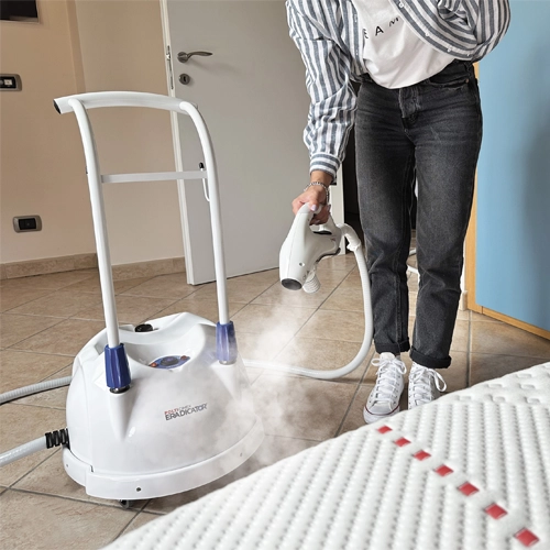 Polti Cimex Eradicator Plus being used to apply superheated dry steam to a mattress for bed bug removal