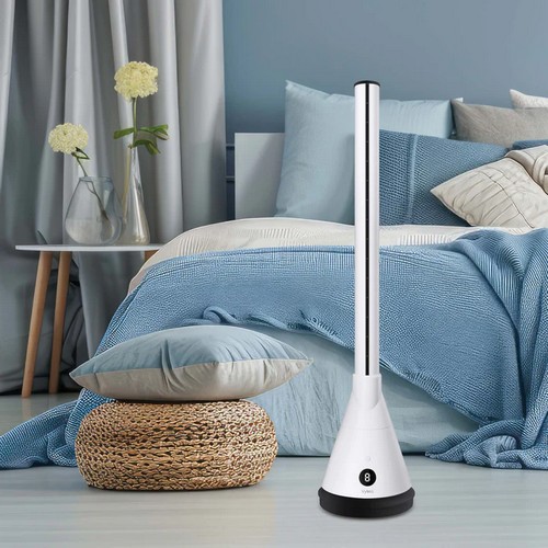 Vybra Spire3 heater cooling fan and air steriliser in white positioned in a bedroom setting