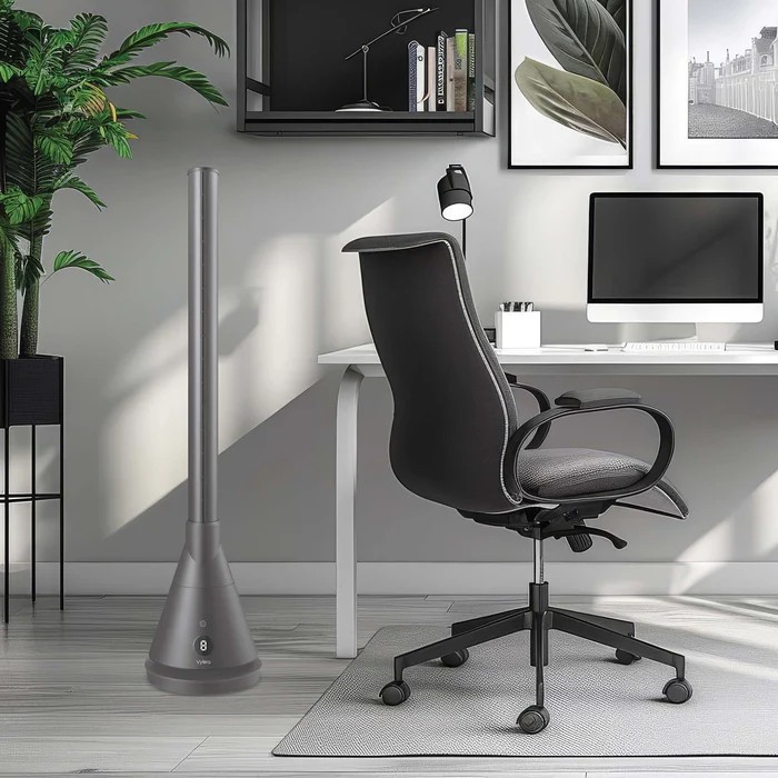 Vybra Spire3 heater cooling fan and air steriliser in grey positioned in a home office environment