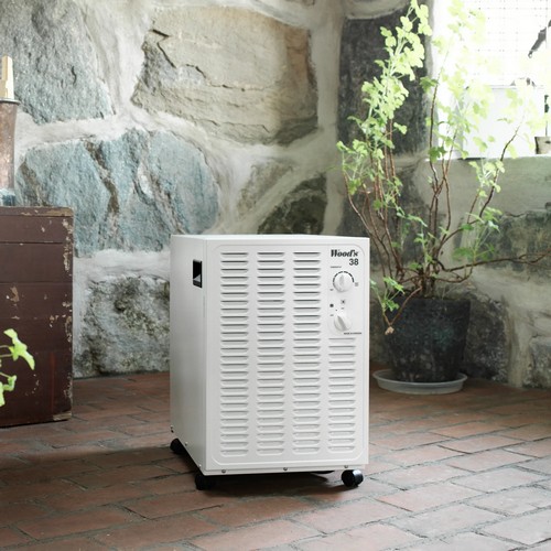Wood’s SW38FW white dehumidifier operating in a stone room
