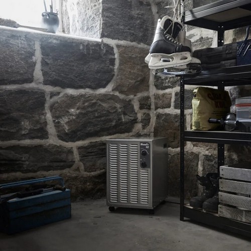 Wood’s SW42FM white dehumidifier operating in a cold basement or stone room