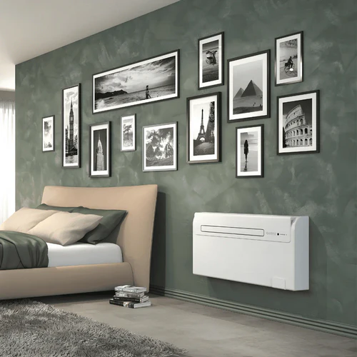 Olimpia Splendid Unico AIR HP EFA slim monobloc air conditioner installed in bedroom interior